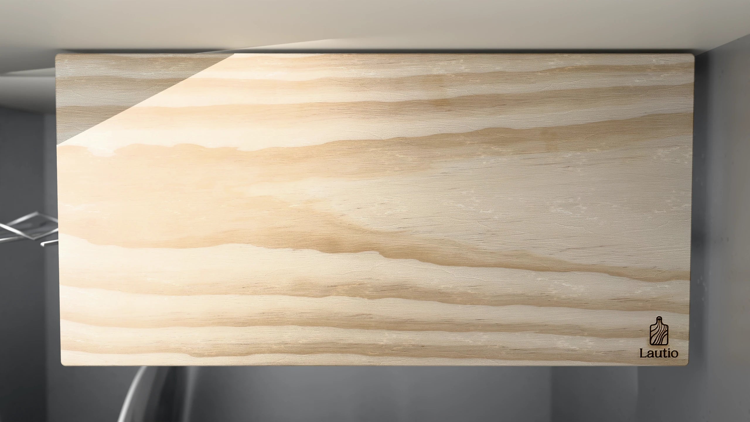 A Lautio Large board standing between the tines of a dishwasher rack